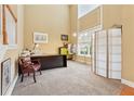 Home office with high ceilings, carpeted floor, large window, and adjacent to living area at 1527 Sage Ridge Dr, Marietta, GA 30064