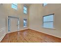 Bright entryway with high ceilings, natural light, and new wood flooring at 634 Sandpiper Cv, Stockbridge, GA 30281
