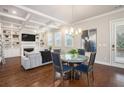 Elegant living room featuring a coffered ceiling, hardwood floors, fireplace, and stylish decor at 3139 Hilltop Dr, Marietta, GA 30066