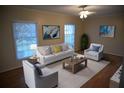Bright living room with neutral furniture, a modern rug, and large windows for ample natural light at 3338 York Pl, Decatur, GA 30032