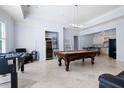 Spacious game room featuring a pool table, foosball, wet bar and beverage fridge at 948 Saint Lyonn Cts, Marietta, GA 30068
