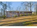 Charming two-story brick home with a manicured lawn and mature trees in a peaceful setting at 1237 Samuel St, Marietta, GA 30008