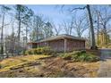 Brick home featuring mature landscaping and a classic architectural style, providing a serene and inviting atmosphere at 1237 Samuel St, Marietta, GA 30008