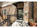 Stone exterior with unit number 400, a secure entry door, and wrought iron railing at 2230 Cheshire Bridge Ne Rd # 410, Atlanta, GA 30324