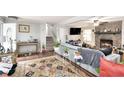 Open living room features a fireplace, hardwood floors, and a staircase to the upper level at 5140 Cowart Ct, Powder Springs, GA 30127