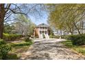 Two-story traditional home features a double staircase leading to a welcoming front porch with classic columns at 3847 Sweet Bottom Dr, Duluth, GA 30096