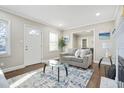 Bright living room with hardwood floors, modern decor, and lots of natural light at 1013 Columbia Dr, Decatur, GA 30030