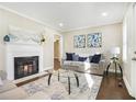 Cozy living room features a fireplace, neutral decor, and ample natural light at 1013 Columbia Dr, Decatur, GA 30030