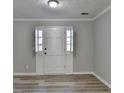 Bright and airy living room featuring neutral paint and modern flooring at 642 Dogwood Dr, Lawrenceville, GA 30046