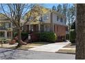 A spacious two-story home featuring brick and stone accents, a well-manicured lawn, and convenient driveway at 2019 Mason Mill Rd, Decatur, GA 30033