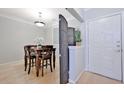 Cozy dining area with wood table and chairs, complemented by natural light at 10 Perimeter Summit Ne Blvd # 1208, Brookhaven, GA 30319