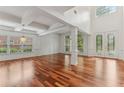 Spacious living room featuring hardwood floors, coffered ceilings, and lots of natural light at 4540 Hastings Dr, Cumming, GA 30041