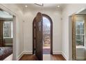 Inviting foyer showcasing hardwood floors and an arched doorway to the front yard at 46 Montclair Ne Dr, Atlanta, GA 30309