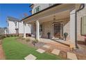 Attractive brick home with a covered front porch and manicured lawn at 812 Newsome Nw Aly, Marietta, GA 30064