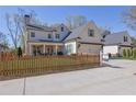 Beautiful two-story home with a picket fence and well-maintained yard at 812 Newsome Nw Aly, Marietta, GA 30064