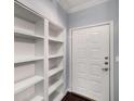 Bright entryway with built-in shelves and a crisp white front door at 821 Ralph Mcgill Ne Blvd # 2210, Atlanta, GA 30306