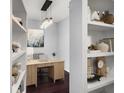 Comfortable home office area with built-in shelving, designer lighting, and neutral colors at 821 Ralph Mcgill Ne Blvd # 2210, Atlanta, GA 30306