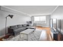 Modern gray living room featuring a hardwood floor and a city view window at 2479 Peachtree Ne Rd # 1606, Atlanta, GA 30305