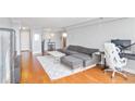 Open-concept living room features hardwood floors, gray walls, and a city view at 2479 Peachtree Ne Rd # 1606, Atlanta, GA 30305