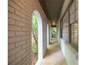 Long view of brick arched entry with white painted brick and window on right side at 5384 Blackhawk Dr, Acworth, GA 30102