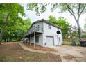 Exterior view of home with basketball hoop and a white garage door at 5384 Blackhawk Dr, Acworth, GA 30102