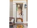 Inviting entryway features a charming welcome mat, stylish decor, and a glimpse of the staircase at 2130 Monhegan Se Way # 11, Smyrna, GA 30080