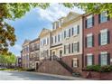 Attractive townhome exteriors featuring a blend of brick and siding, showcasing curb appeal at 2130 Monhegan Se Way # 11, Smyrna, GA 30080