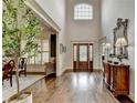 Grand foyer with hardwood floors, high ceilings, and ornate front door and staircase at 3006 Cambridge Hill Dr, Dacula, GA 30019