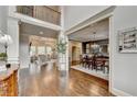 Spacious living room featuring hardwood floors, coffered ceiling, and open floor plan at 3006 Cambridge Hill Dr, Dacula, GA 30019