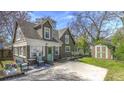 Charming cottage-style home with a landscaped front yard, brick foundation and a private driveway at 20 Screven Ne St, Atlanta, GA 30307