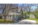 Charming cottage-style home with a landscaped front yard, brick foundation and a private driveway at 20 Screven Ne St, Atlanta, GA 30307