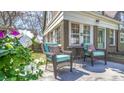 Inviting outdoor patio seating area with comfortable wicker chairs, perfect for relaxing and enjoying the view at 20 Screven Ne St, Atlanta, GA 30307