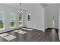 Elegant dining area featuring hardwood floors, natural light, and classic trim at 380 Waterbluff Dr, Mableton, GA 30126