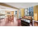Bright living room with hardwood floors, large windows, and a comfortable sofa perfect for relaxing and entertaining at 145 15Th Ne St # 204, Atlanta, GA 30309