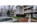 Apartment building with beige siding and a front yard with shrubbery at 1701 Augusta Se Dr # 1701, Marietta, GA 30067