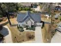 Overhead shot of a home with a well-maintained lawn, long driveway, and fenced-in backyard at 1732 Red Maple Rdg, Atlanta, GA 30316