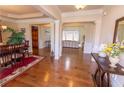 Spacious foyer with hardwood floors and elegant columns leading to living spaces at 1960 Overlook Springs Ln, Cumming, GA 30040