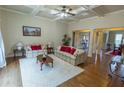 Inviting living room with coffered ceiling, hardwood floors, and ample natural light at 1960 Overlook Springs Ln, Cumming, GA 30040