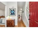 Bright foyer with a red door, hardwood floors, and a view into the living spaces at 1087 High Point Ne Dr, Atlanta, GA 30306