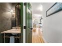 Charming powder room boasts marble countertop, stylish faucet, and a decorative mirror for added elegance at 1087 High Point Ne Dr, Atlanta, GA 30306