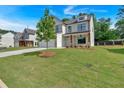 Beautiful two-story home with a well-maintained lawn, a two-car garage, and inviting front porch at 376 Waterbluff Dr, Mableton, GA 30126