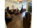 Spacious living room with hardwood floors, ample seating, and plenty of natural light at 1302 Speckle Park Way, Stockbridge, GA 30281
