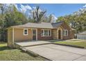 Lovely home with brick and siding, featuring a spacious front yard and ample parking at 2836 Waters Sw Rd, Atlanta, GA 30354