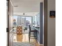 Inviting entryway showcasing hardwood floors, leading to the living area with city views at 3338 Peachtree Ne Rd # 2804, Atlanta, GA 30326