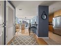 Inviting entryway shows an open floor plan with a kitchen, bar seating, and hardwood floors at 3338 Peachtree Ne Rd # 2804, Atlanta, GA 30326