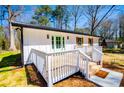 Charming home with white siding, shutters, and a lovely, inviting front porch at 116 Carroll St, Temple, GA 30179