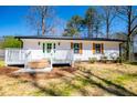 Charming home with white siding, shutters, and a lovely, inviting front porch at 116 Carroll St, Temple, GA 30179