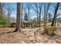 Spacious lot with mature trees surrounding a brick home for privacy at 2696 Dodson Dr, East Point, GA 30344