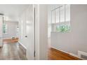 Hallway featuring hardwood floors, neutral walls and an open archway at 2696 Dodson Dr, East Point, GA 30344