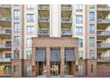 Low angle exterior showcasing the building's balconies and entrance, highlighting architectural details at 711 Cosmopolitan Ne Dr # 523, Atlanta, GA 30324